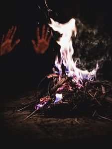 Preview wallpaper bonfire, fire, hands, flame, sparks, dark