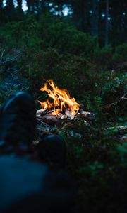 Preview wallpaper bonfire, fire, legs, camping, rest, grass