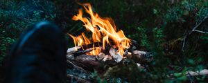 Preview wallpaper bonfire, fire, legs, camping, rest, grass