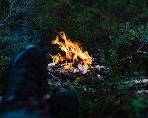 Preview wallpaper bonfire, fire, legs, camping, rest, grass