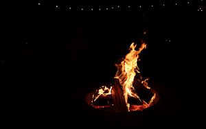 Preview wallpaper bonfire, fire, logs, black