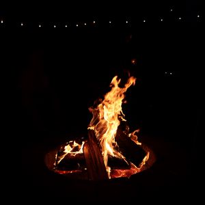 Preview wallpaper bonfire, fire, logs, black