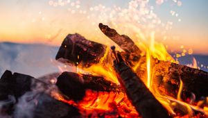 Preview wallpaper bonfire, fire, sparks, firewood, blur, camping