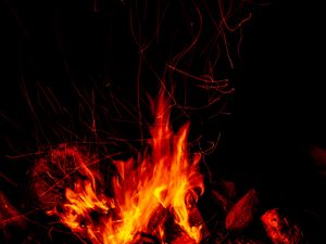 Preview wallpaper bonfire, fire, sparks, flame, dark