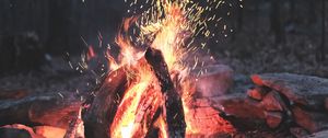 Preview wallpaper bonfire, fire, sparks, stones, firewood, burn