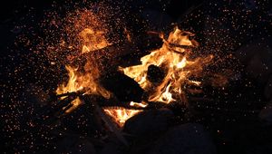 Preview wallpaper bonfire, fire, sparks, dark, flame
