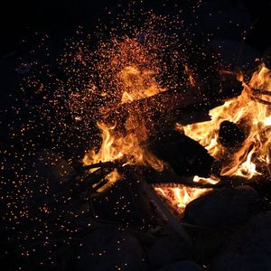 Preview wallpaper bonfire, fire, sparks, dark, flame