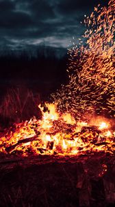 Preview wallpaper bonfire, fire, sparks, heat, dark