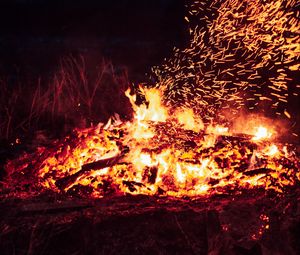 Preview wallpaper bonfire, fire, sparks, heat, dark