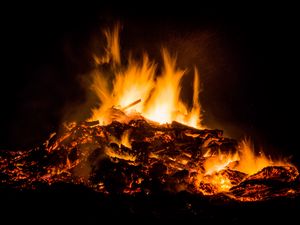 Preview wallpaper bonfire, fire, sparks, dark