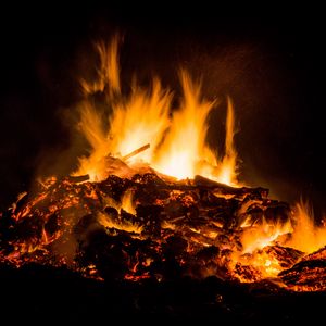 Preview wallpaper bonfire, fire, sparks, dark