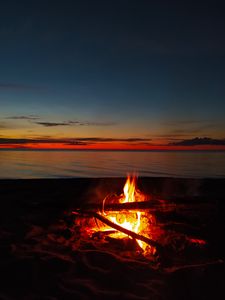 Preview wallpaper bonfire, flame, firewood, sunset, horizon