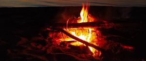 Preview wallpaper bonfire, flame, firewood, sunset, horizon