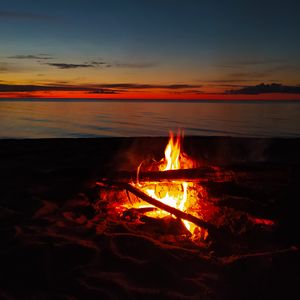 Preview wallpaper bonfire, flame, firewood, sunset, horizon