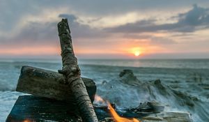 Preview wallpaper bonfire, flame, logs, coals, sunset