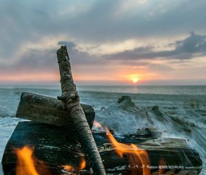 Preview wallpaper bonfire, flame, logs, coals, sunset