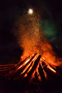 Preview wallpaper bonfire, flame, sparks, logs, night, dark