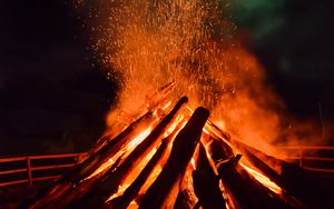 Preview wallpaper bonfire, flame, sparks, logs, night, dark
