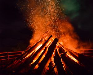 Preview wallpaper bonfire, flame, sparks, logs, night, dark