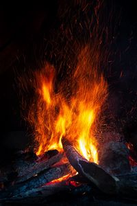 Preview wallpaper bonfire, logs, firewood, sparks, darkness, flame