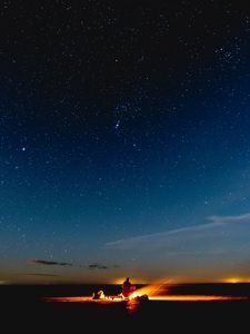 Preview wallpaper bonfire, silhouette, camping, starry sky, night