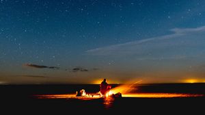 Preview wallpaper bonfire, silhouette, camping, starry sky, night