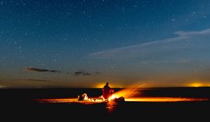 Preview wallpaper bonfire, silhouette, camping, starry sky, night