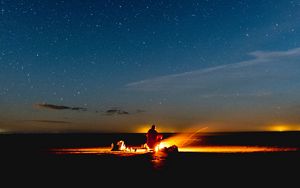 Preview wallpaper bonfire, silhouette, camping, starry sky, night