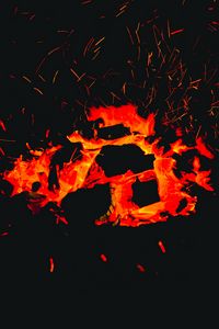 Preview wallpaper bonfire, sparks, coals, heat, dark