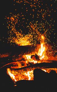 Preview wallpaper bonfire, sparks, logs, fire, black