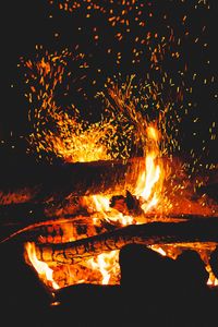 Preview wallpaper bonfire, sparks, logs, fire, black