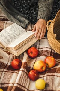 Preview wallpaper book, apples, hand, plaid, rest