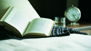 Preview wallpaper book, bed, alarm clock, reading