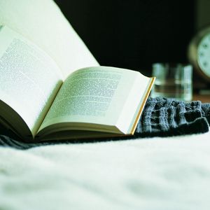 Preview wallpaper book, bed, alarm clock, reading