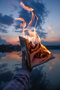 Preview wallpaper book, fire, hand, flame, dusk