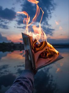 Preview wallpaper book, fire, hand, flame, dusk