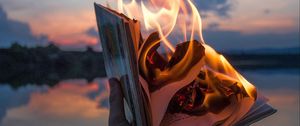 Preview wallpaper book, fire, hand, flame, dusk