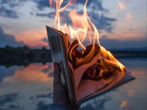 Preview wallpaper book, fire, hand, flame, dusk