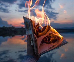 Preview wallpaper book, fire, hand, flame, dusk