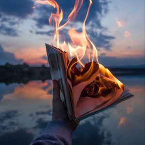 Preview wallpaper book, fire, hand, flame, dusk