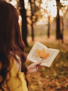 Preview wallpaper book, leaf, hand, autumn, blur