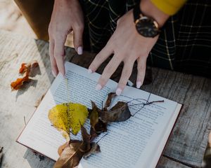 Preview wallpaper book, leaves, hands, autumn, aesthetics