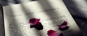 Preview wallpaper book, petals, text, shadow