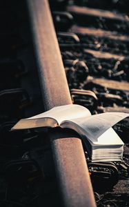 Preview wallpaper book, reading, rails, railroad, aesthetics