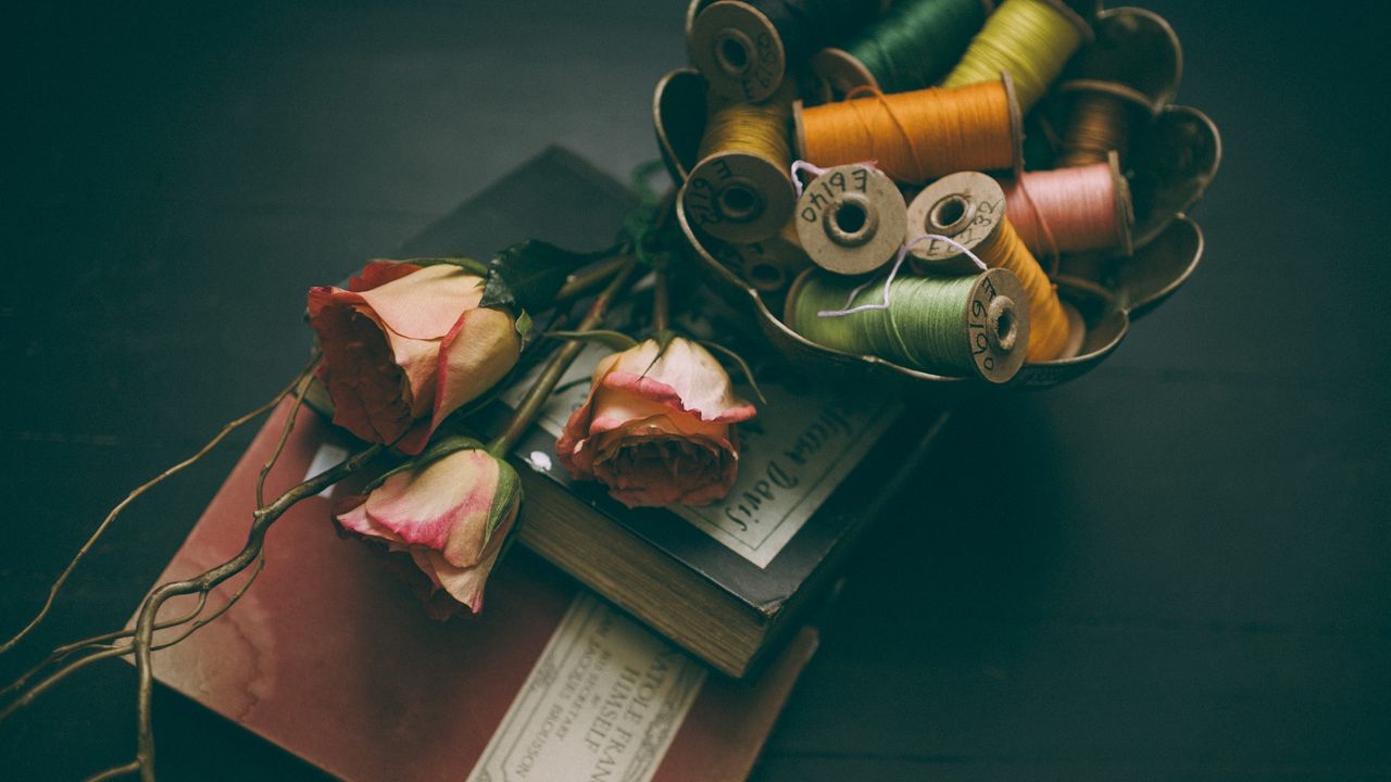 Wallpaper book, thread, rose