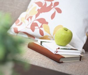 Preview wallpaper books, apple, pillows, blurring