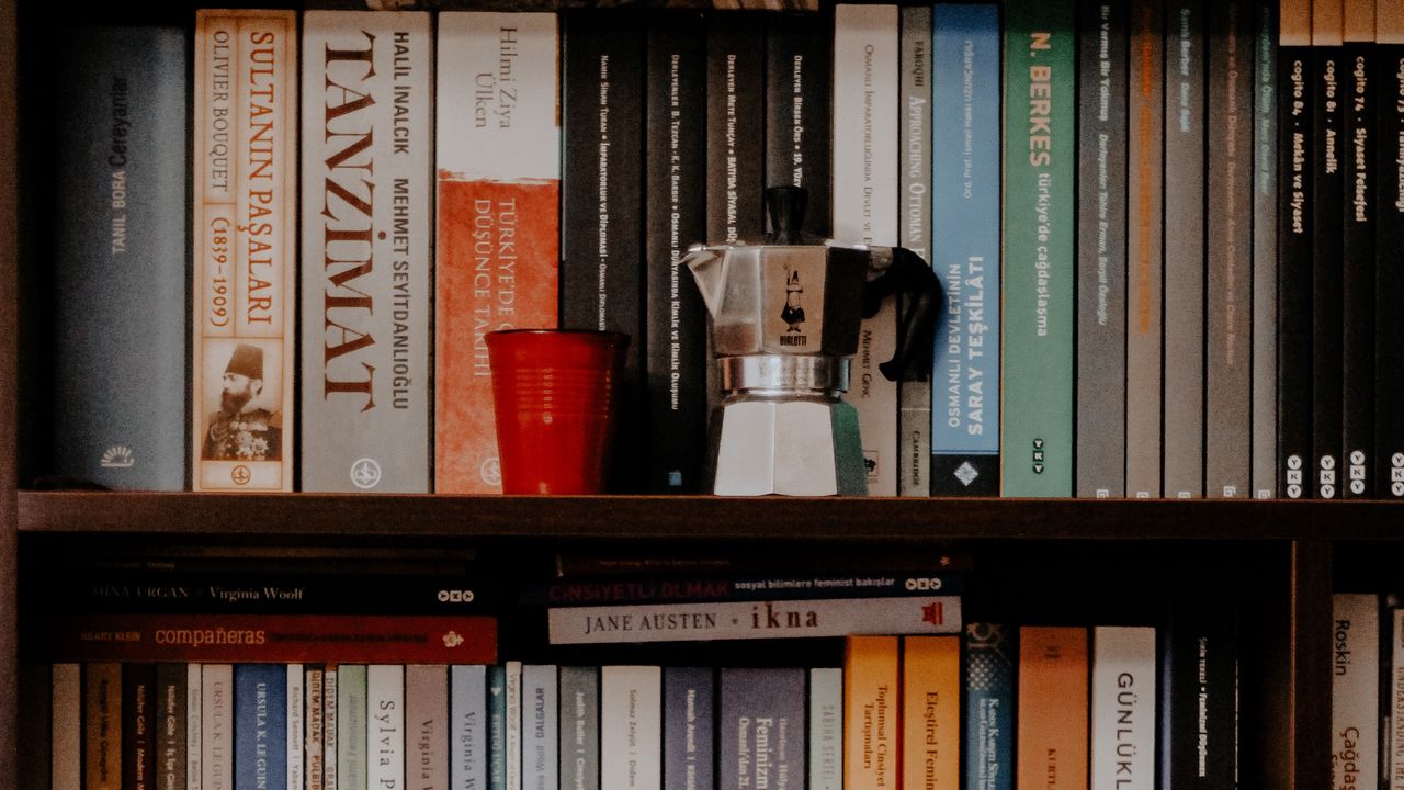 Wallpaper books, shelves, teapot, glass, library