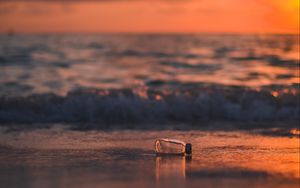 Preview wallpaper bottle, glass, sea, sunset, shore, blur