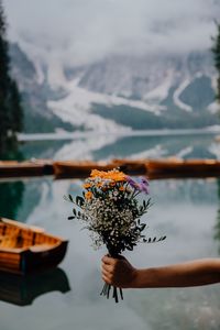 Preview wallpaper bouquet, flowers, hand, focus