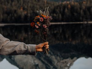 Preview wallpaper bouquet, flowers, hand, landscape, reflection